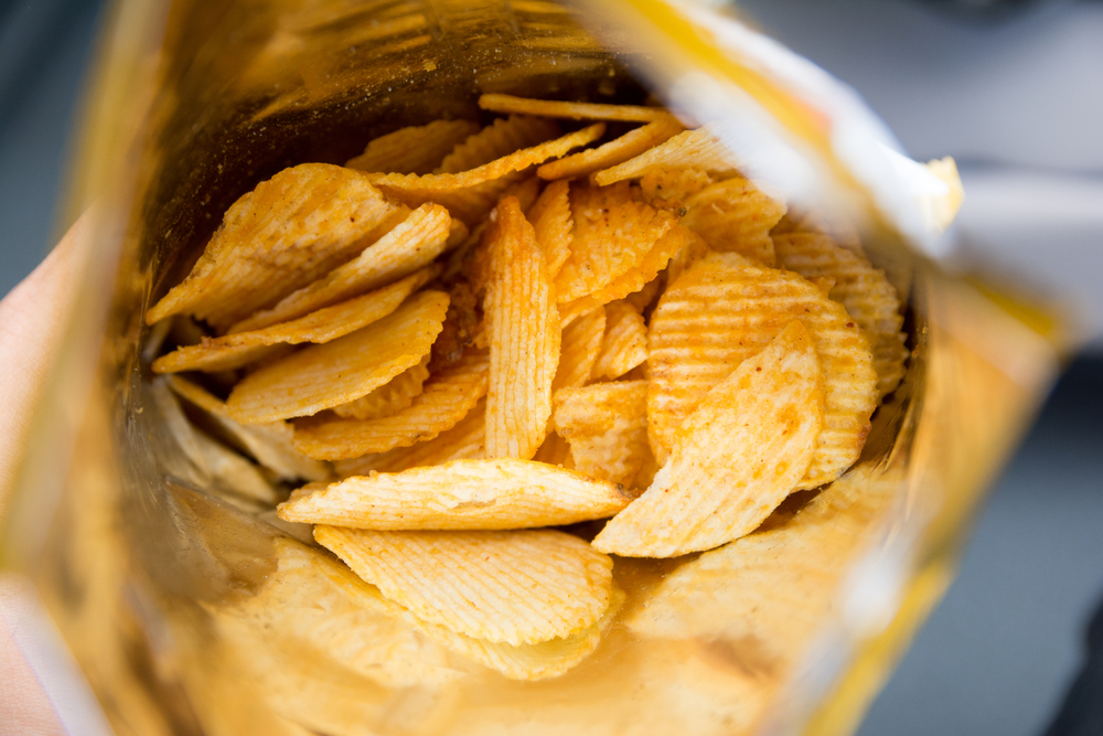 An open bag of potato chips